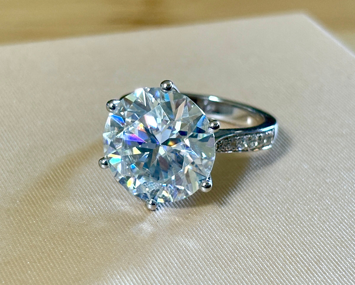 Moissanite ring. The 10ct certified 8H8A Moissanite “Tulip” statement ring with .50cttw Moissanite accents! Photos fail this GORGEOUS ring!