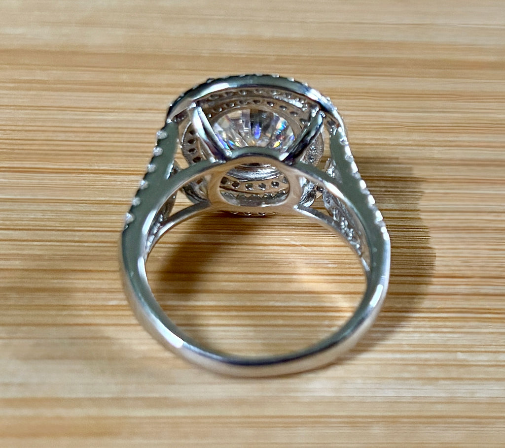 Moissanite ring. The 6.64cttw *fully* Moissanite “Bull’s Eye” ring, featuring a 4ct certified round brilliant Moissanite in a double halo!