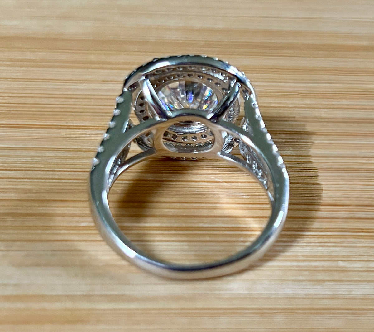 Moissanite ring. The 6.64cttw *fully* Moissanite “Bull’s Eye” ring, featuring a 4ct certified round brilliant Moissanite in a double halo!