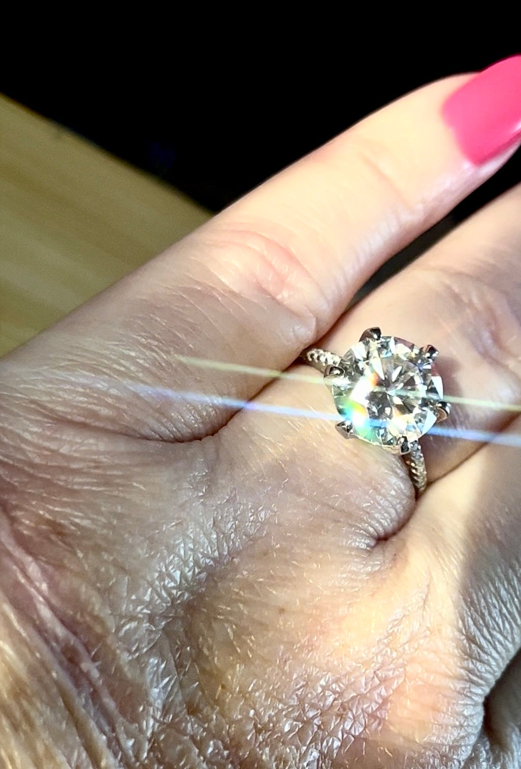 Moissanite ring. A certified 5ct Moissanite solitaire with zircon-accented shoulders, set in sterling silver and bathed in 18k!