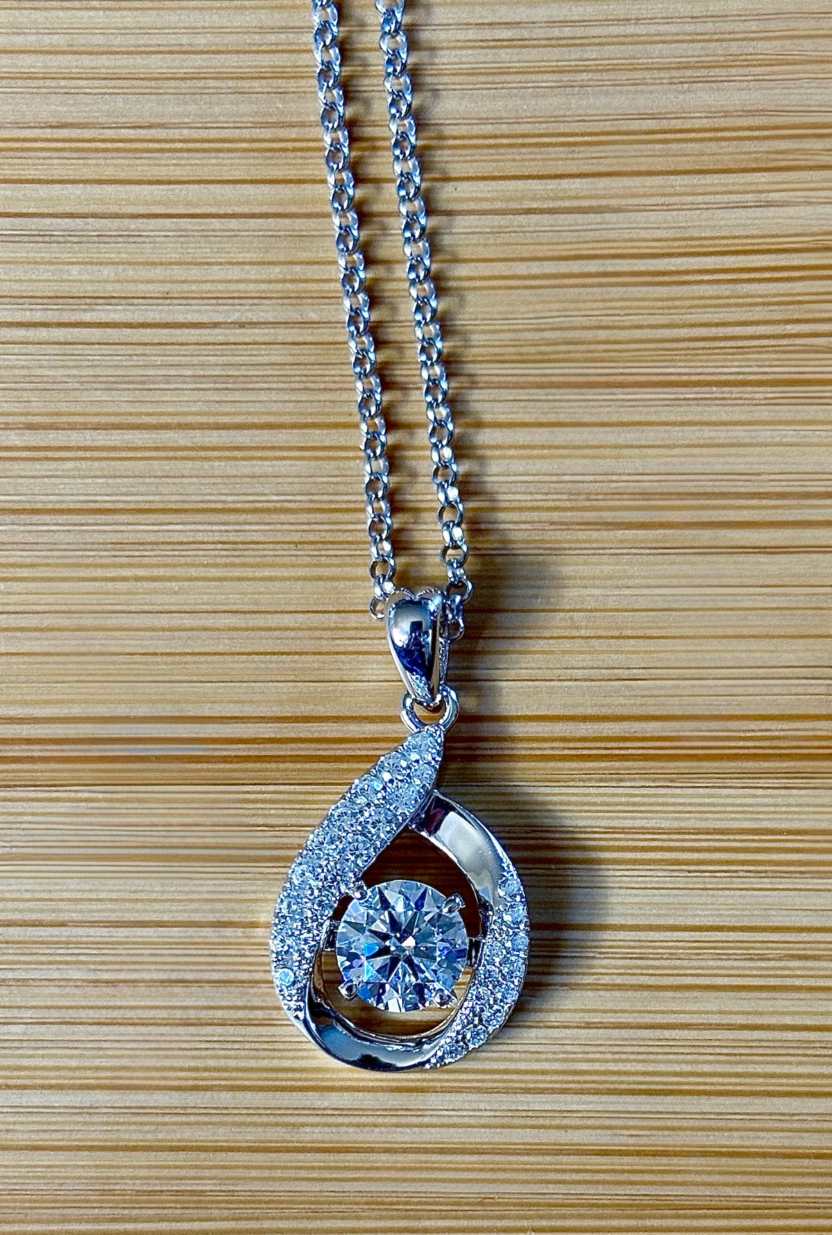 Moissanite necklace. A 1ct 8H8A certified Moissanite water drop-shaped pendant with white zircons, on a nicely weighted rolo chain with lobster claw clasp!