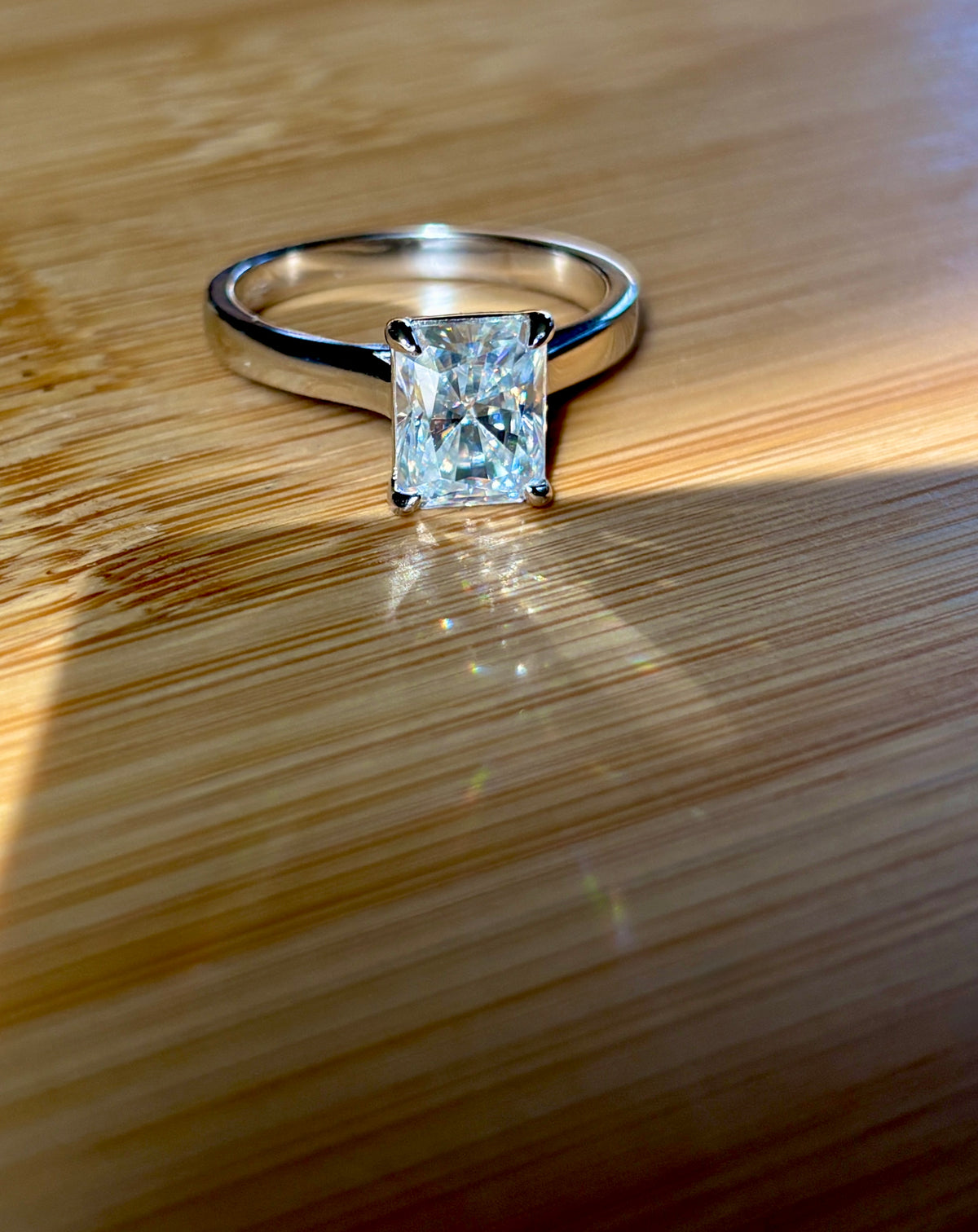 A certified Moissanite 3ct radiant solitaire! An UBER flashy, ULTRA classy, contemporary and chic radiant-cut engagement ring!