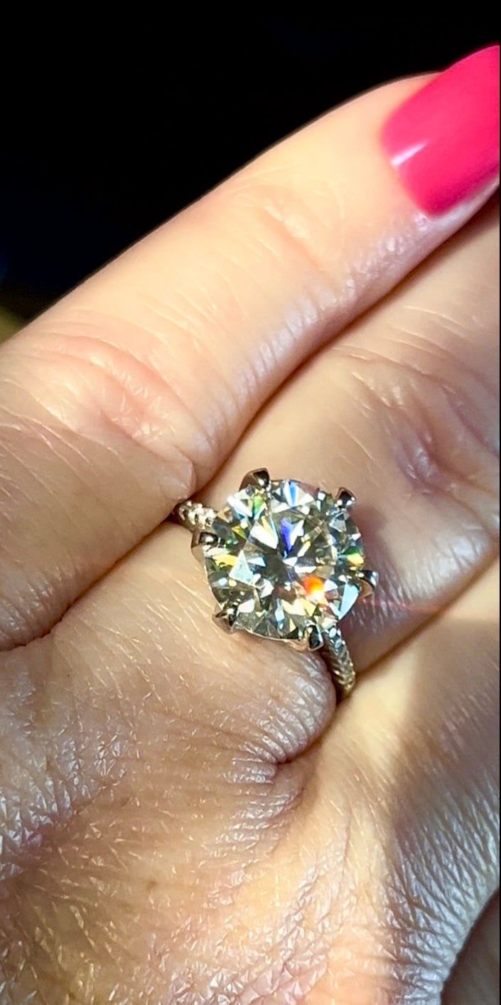 Moissanite ring. A certified 5ct Moissanite solitaire with zircon-accented shoulders, set in sterling silver and bathed in 18k!