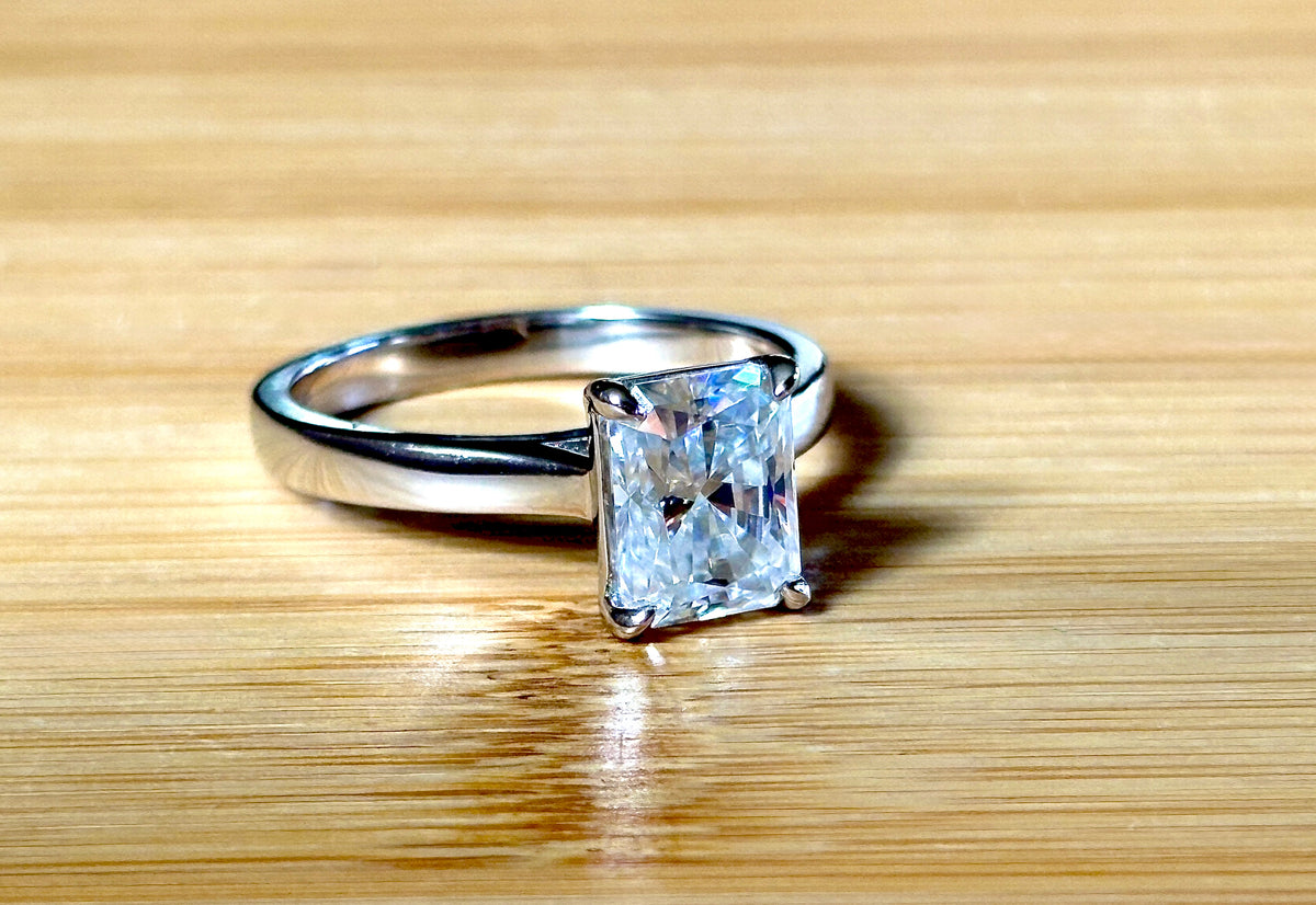 A certified Moissanite 3ct radiant solitaire! An UBER flashy, ULTRA classy, contemporary and chic radiant-cut engagement ring!
