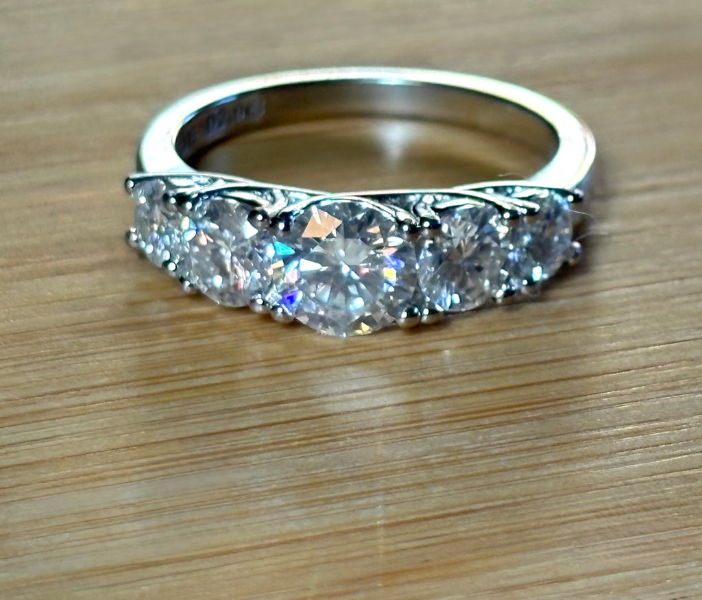 Moissanite ring. A 2.5ctw certified Moissanite ring, for those who want plenty of sparkle but a daintier ring! This feminine 5-stone design is just the thing!