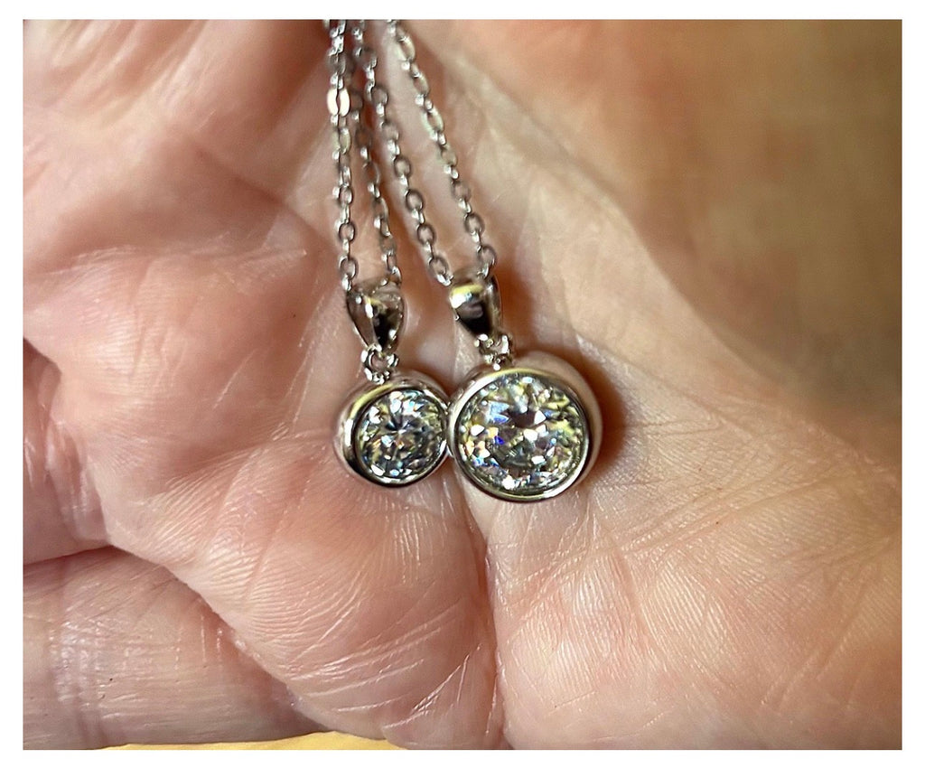 Moissanite necklace. My fiery “bubble bezel” necklace features a 1ct OR 3ct certified Moissanite in a heavy sterling silver bezel setting!