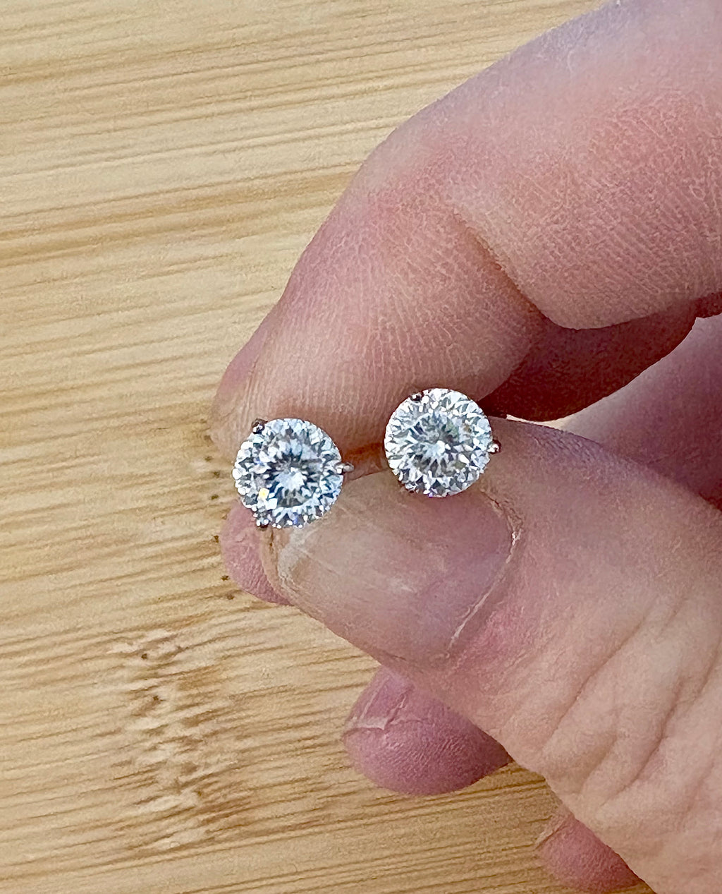 Moissanite studs. A 100-facet 2cttw pair of super bright, DOUBLE certified Moissanite studs in sterling silver and 18k white rhodium! Sublime!