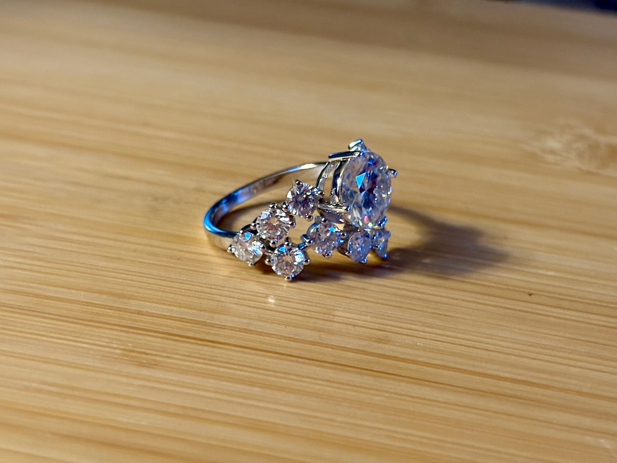 Moissanite ring. The “Moissanite Galaxy” ring features a 3ct certified Moissanite amid a 4cttw Moissanite constellation  - a 7cttw ring!