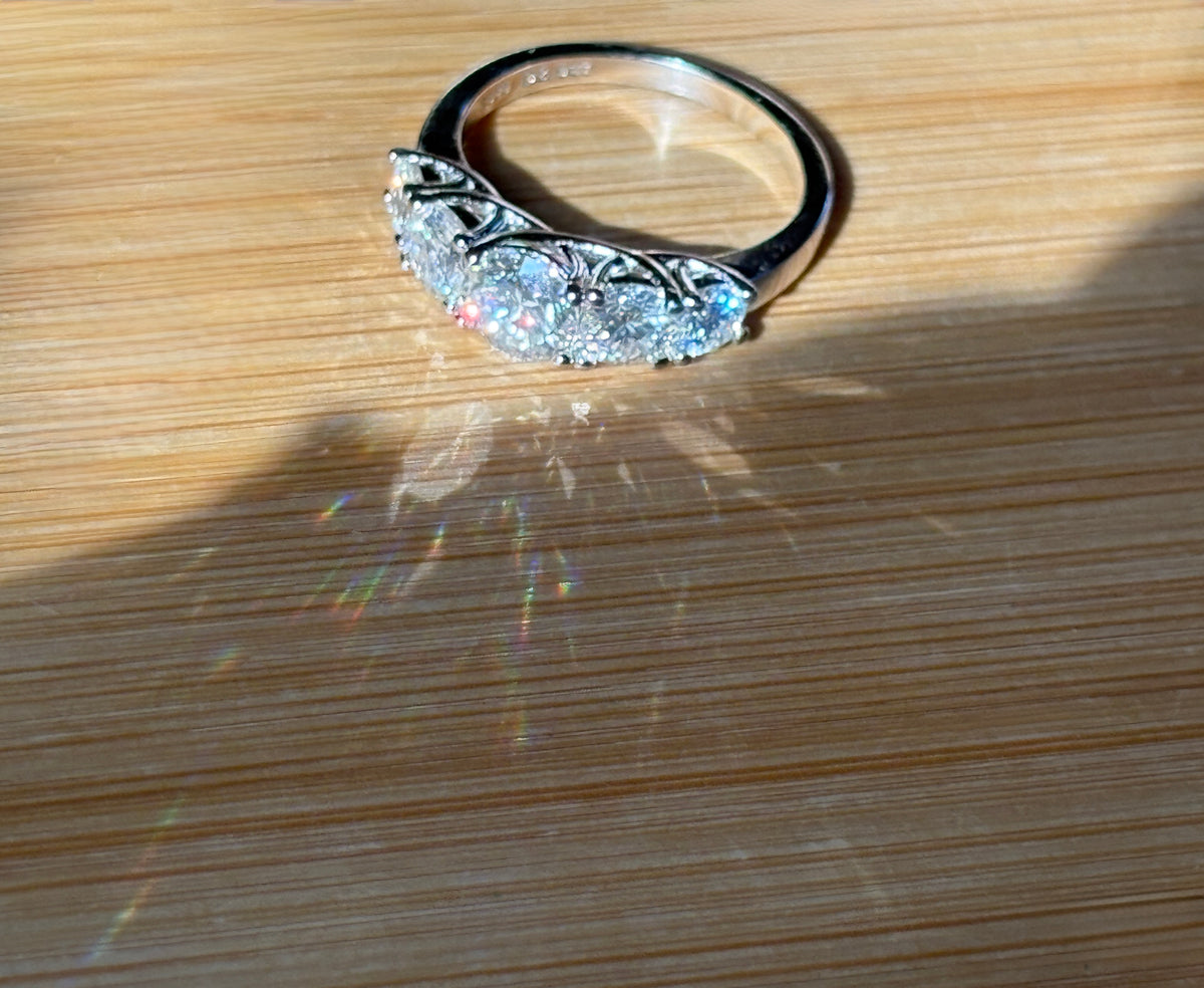Moissanite ring. A 2.5ctw certified Moissanite ring, for those who want plenty of sparkle but a daintier ring! This feminine 5-stone design is just the thing!