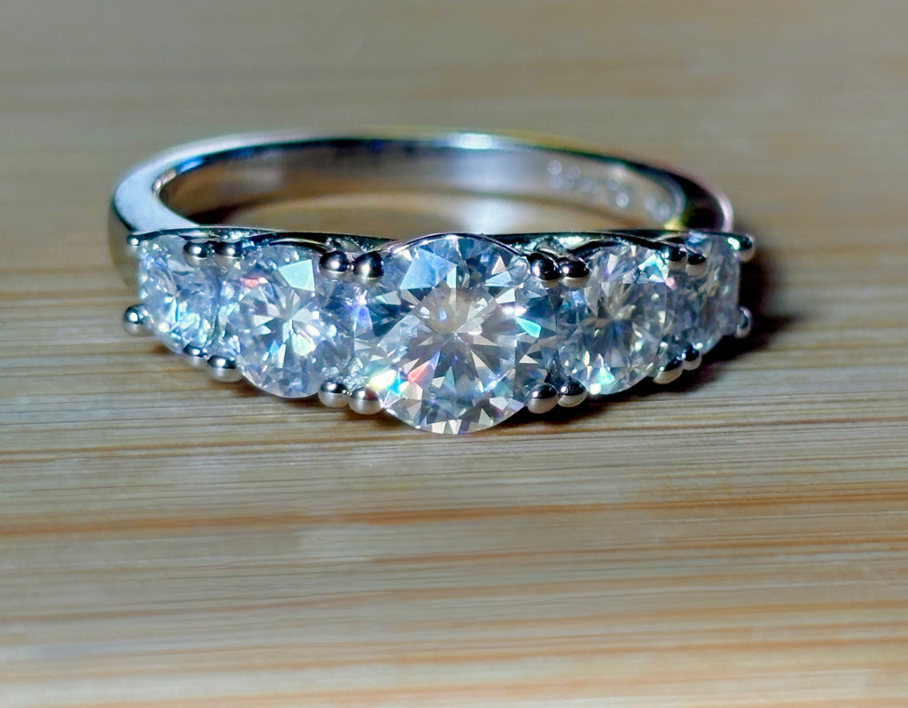 Moissanite ring. A 2.5ctw certified Moissanite ring, for those who want plenty of sparkle but a daintier ring! This feminine 5-stone design is just the thing!