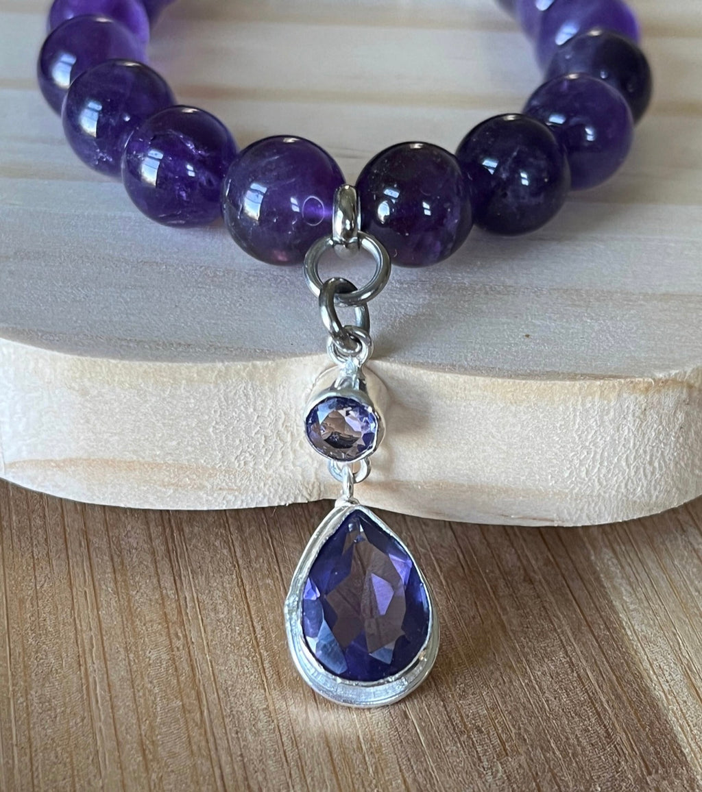 Amethyst bracelet. Natural and vibrant 10mm amethyst beads and stainless steel! The amethyst pendant in solid sterling silver is optional.