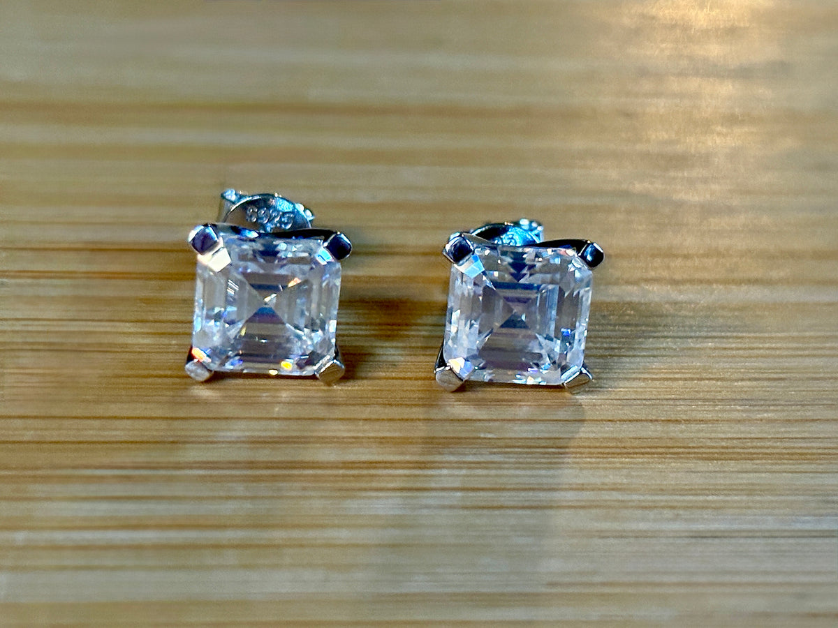 Moissanite studs. A 6.4ctw *perfect* pair of DOUBLE certified Asscher-cut Moissanites in my custom 4-claw 935 ARGENTIUM silver mountings! Opulent!