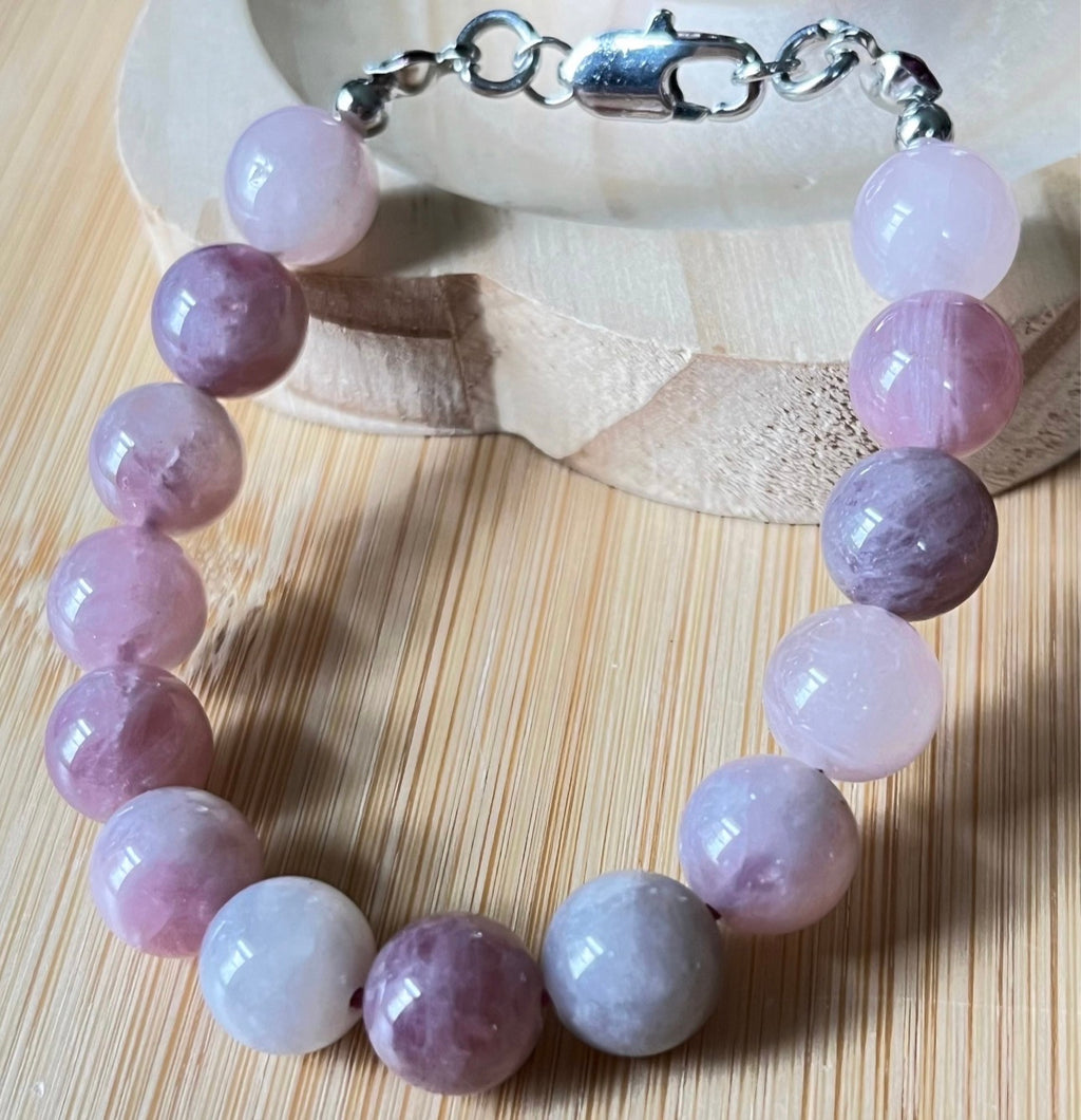 Madagascar rose quartz bracelet. Hands-down GORGEOUS AAA-grade 10.5mm purple-pink rose quartz beads and with varying degrees of crystallization and color!