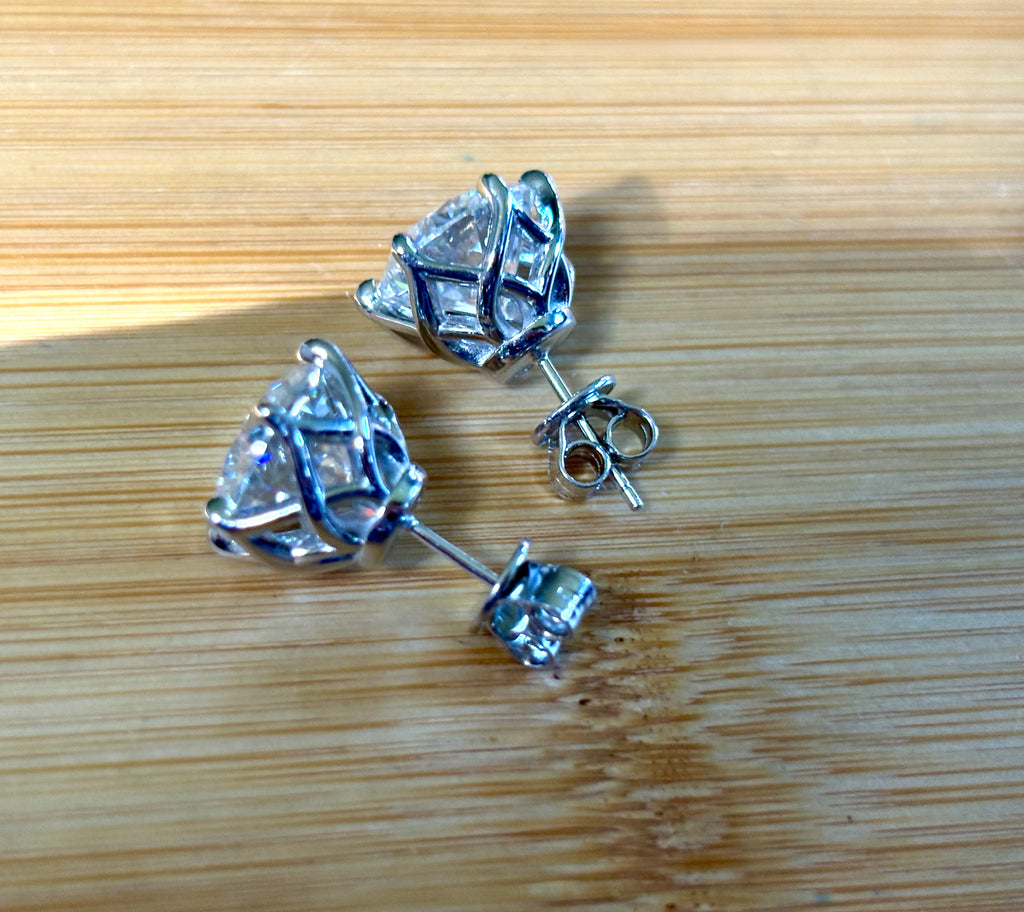A 10ctw pair of double certified Moissanite studs in lotus-shaped sterling silver baskets!