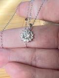 Moissanite necklace. A 1ct or 3ct Moissanite in a halo of sparkling white zircons (I call it the “Sunflower” pendant)! In sterling silver and 18k!