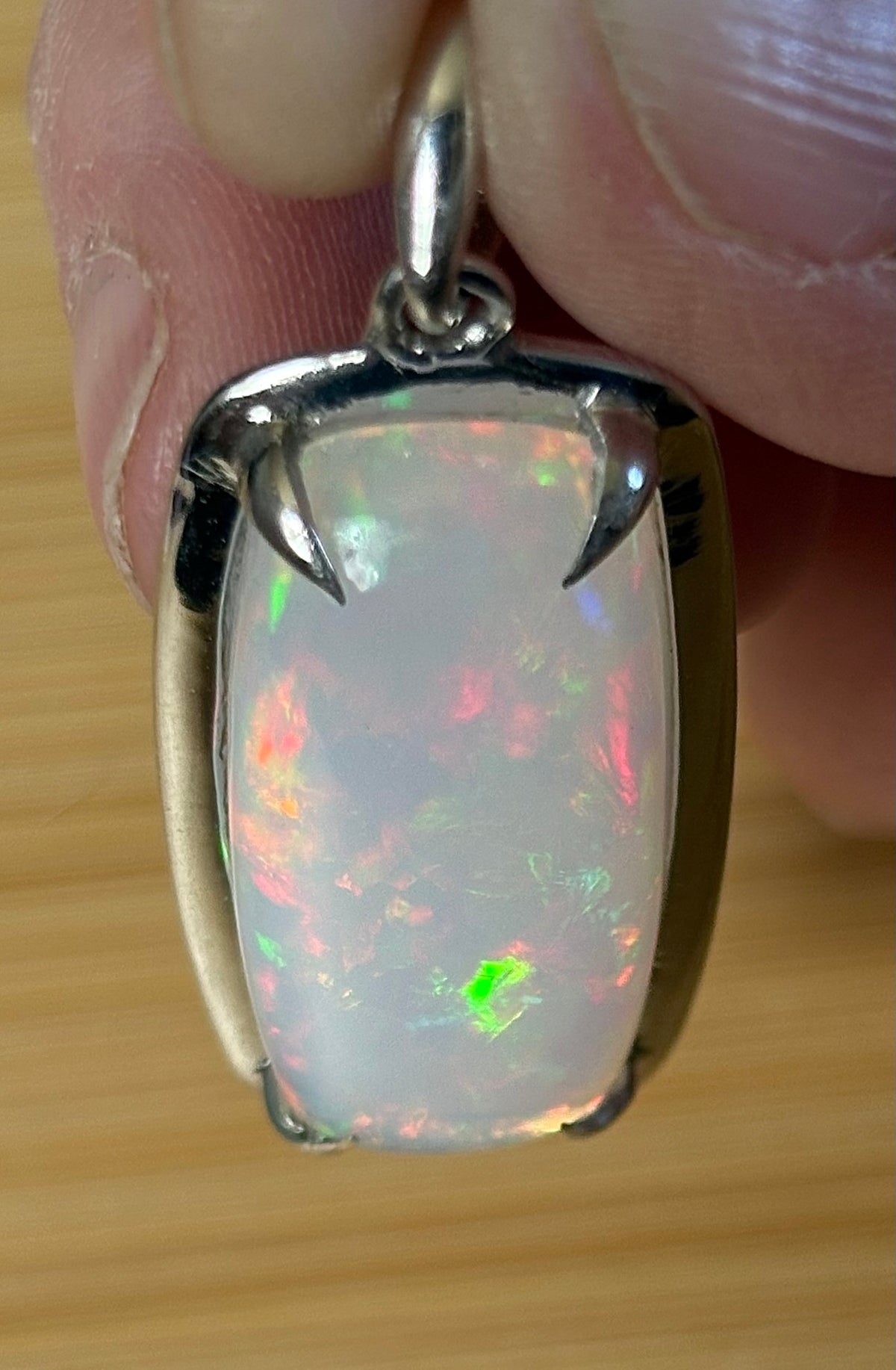 A 21ct AAA grade Ethiopian opal pendant, a handpicked opal and exclusive HKJ design! This lovely opal has gorgeous fire and play of color!