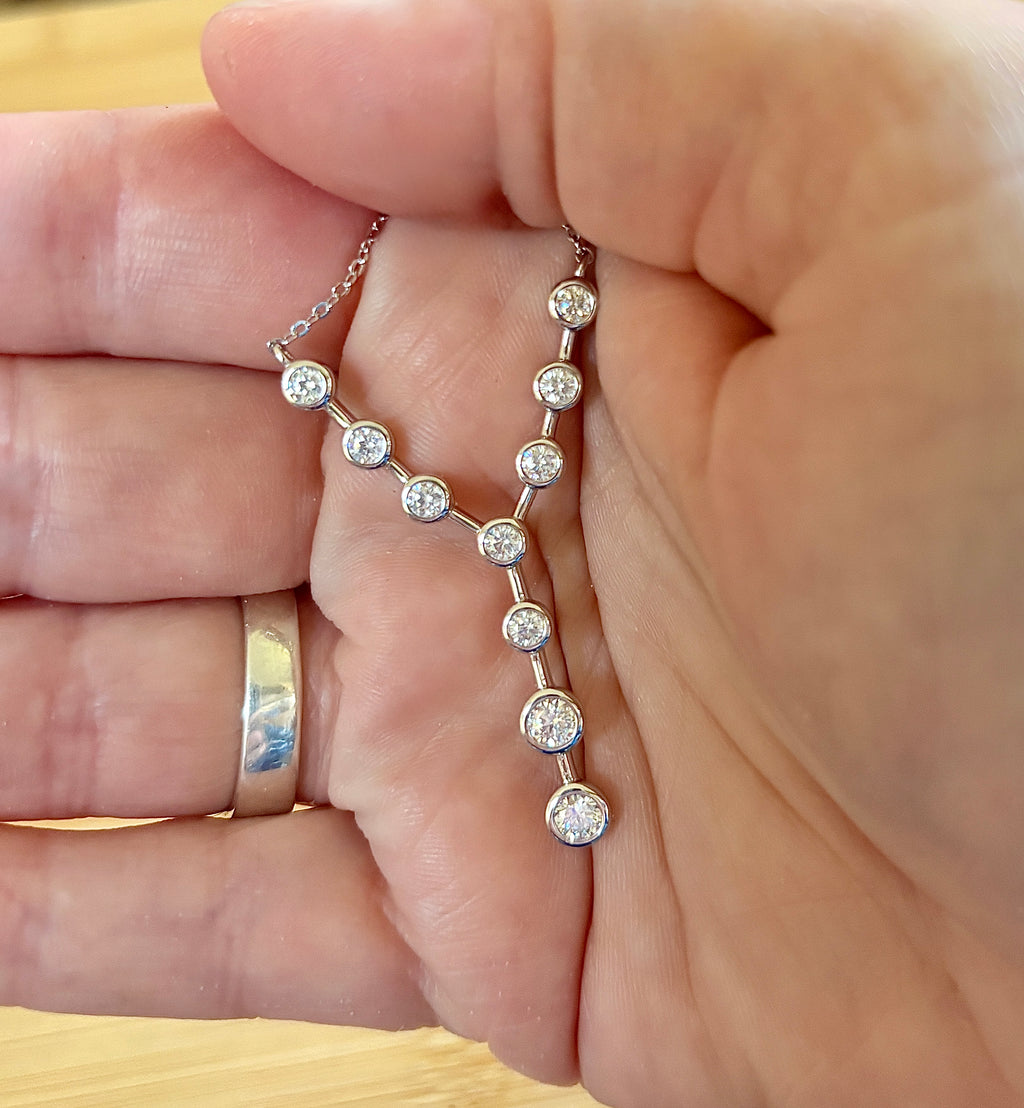 Moissanite neckpiece. A beautiful certified 1.4cttw Moissanite necklace featuring 10 round brilliants in a solid sterling bezel setting!