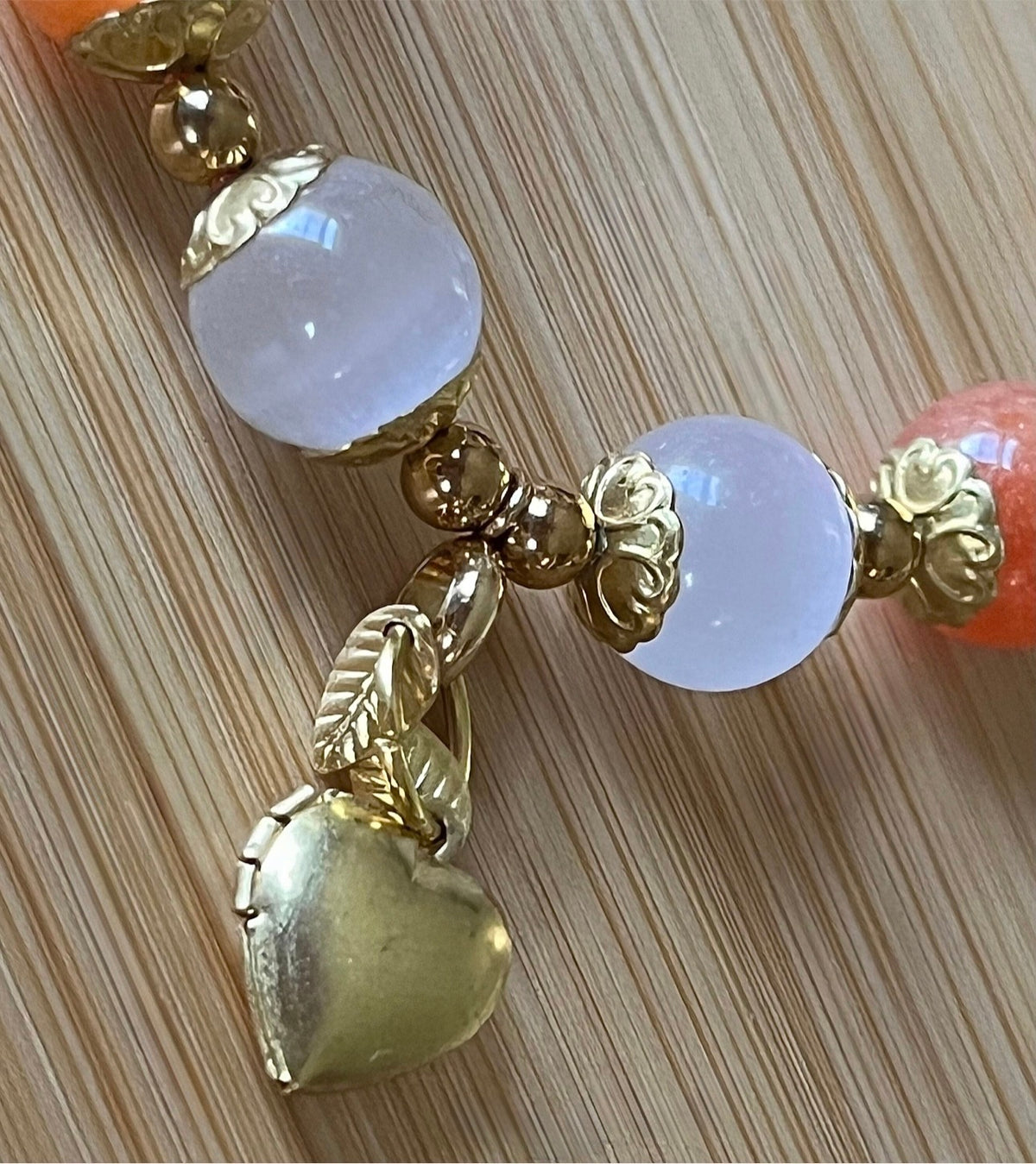 White selenite and tangerine chalcedony bracelet with raw brass and stainless steel components. The functioning brass locket is included!