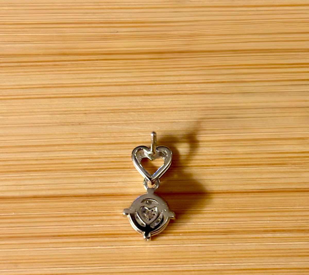 Moissanite earrings. Certified 2cttw round brilliant Moissanites dangling from heart-shaped posts are perfect for your Valentine (or you)!