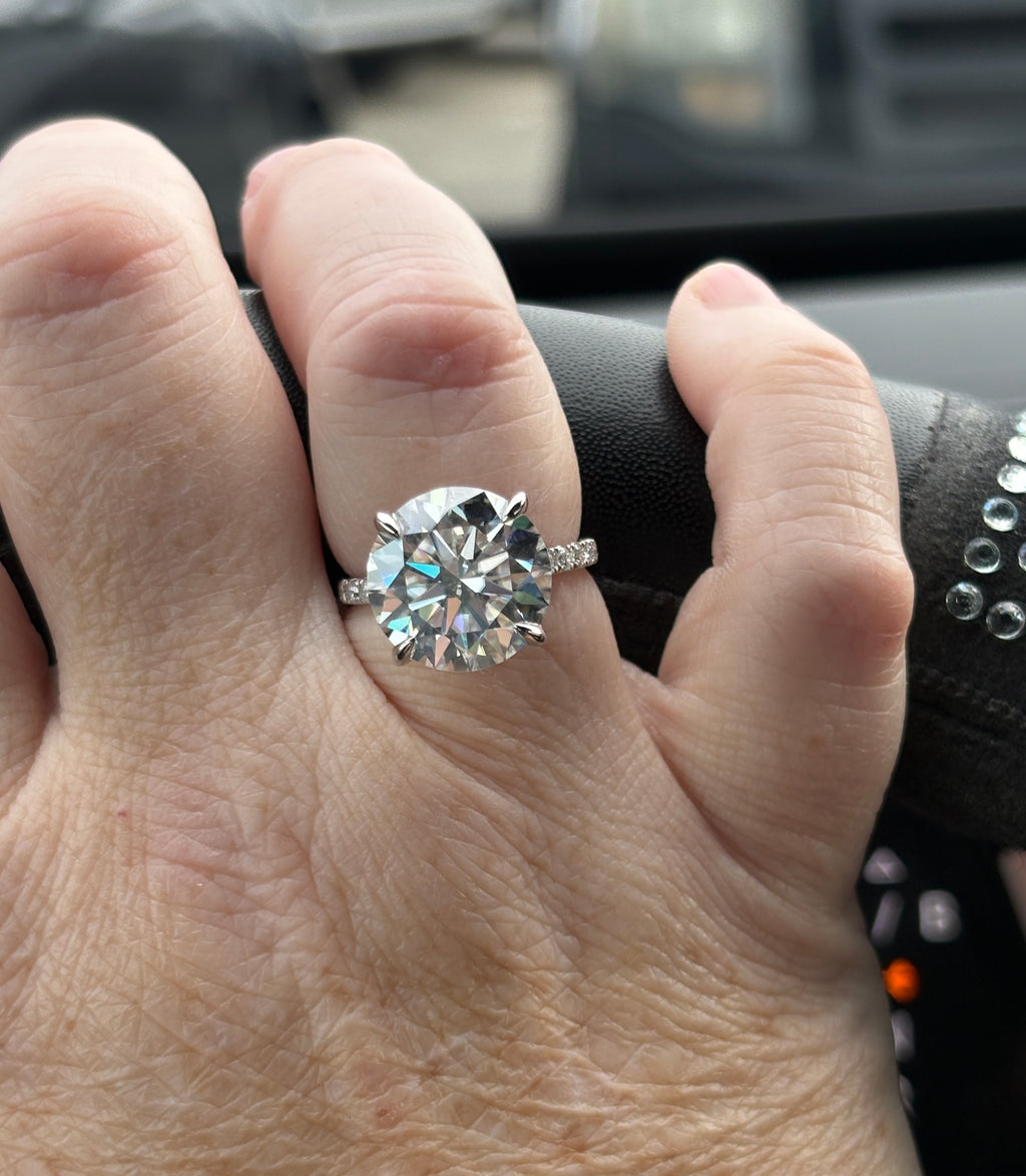 Moissanite solitaire. A glorious 10ct 8H8A Moissanite in a 4-prong mounting with a Moissanite “hidden halo” and shoulders, an 11.3cttw ring!