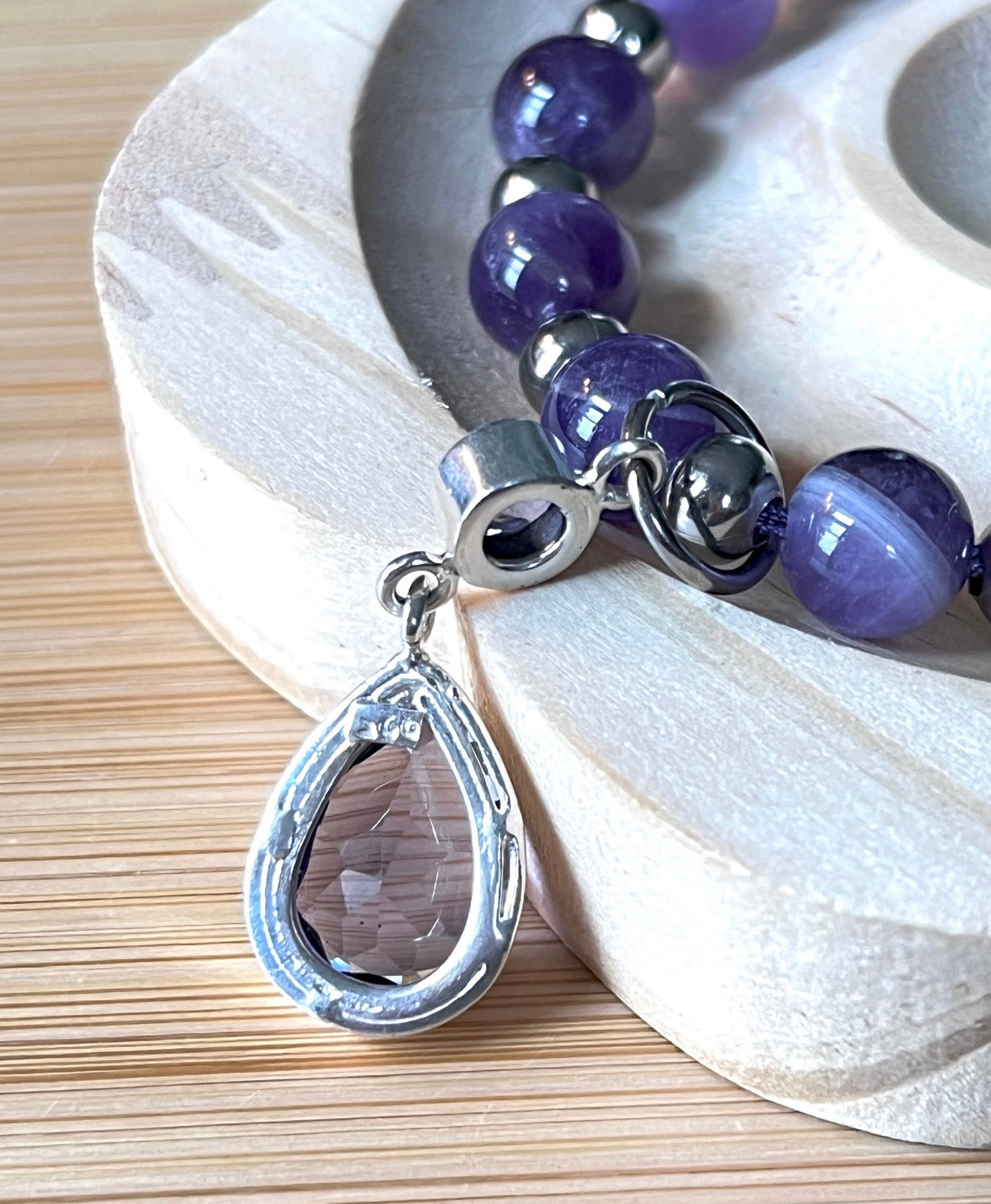 Amethyst bracelet. Pretty purple amethysts with chevron pattern crystallization! 8mm beads with durable stainless steel bracelet hardware!