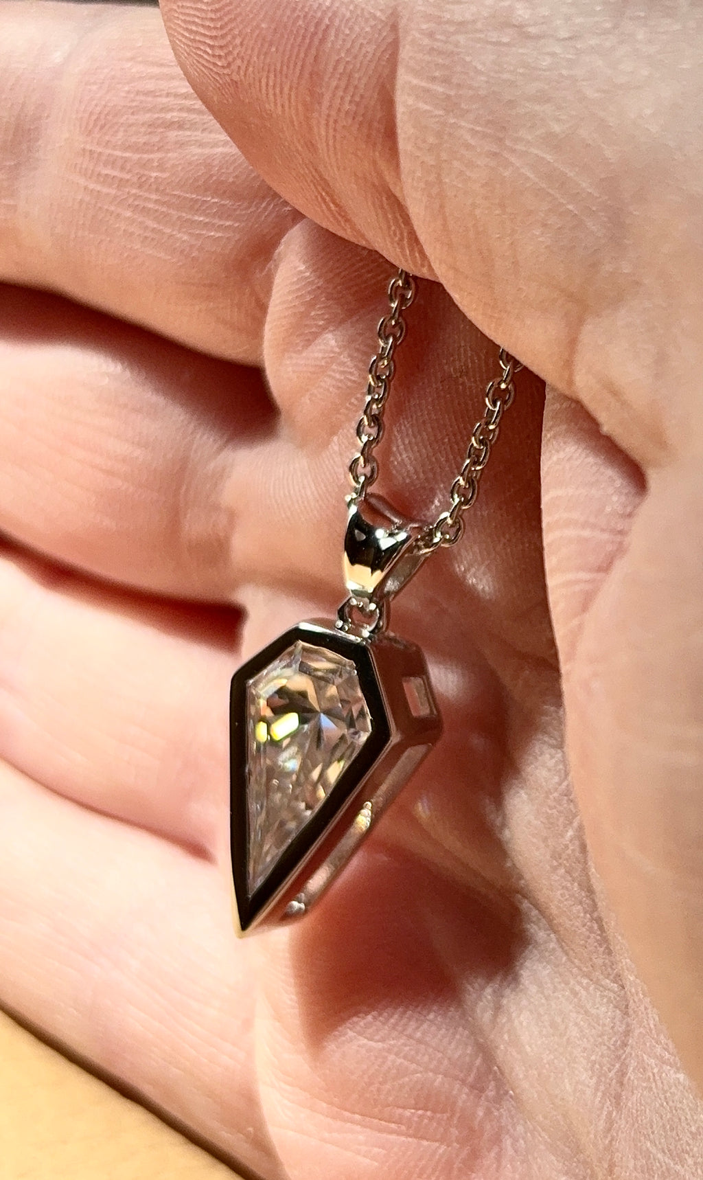 Moissanite necklace. “Flight!”, a kite-shaped, custom-cut 5ct Moissanite pendant! Hand-faceted by a master stone cutter and set in Argentium silver, it is suspended on a 20” sterling silver chain and is exclusive to Hand Knotted Jewelry!