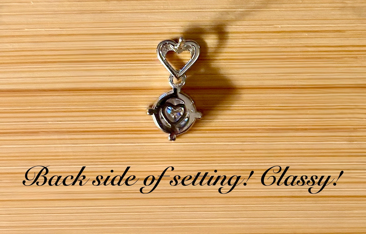 Moissanite earrings. Certified 2cttw round brilliant Moissanites dangling from heart-shaped posts are perfect for your Valentine (or you)!