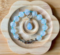 Rainbow moonstone bracelet, hand knotted with high quality 9-10mm beads! The solid sterling silver moonstone pendant is *optional*.