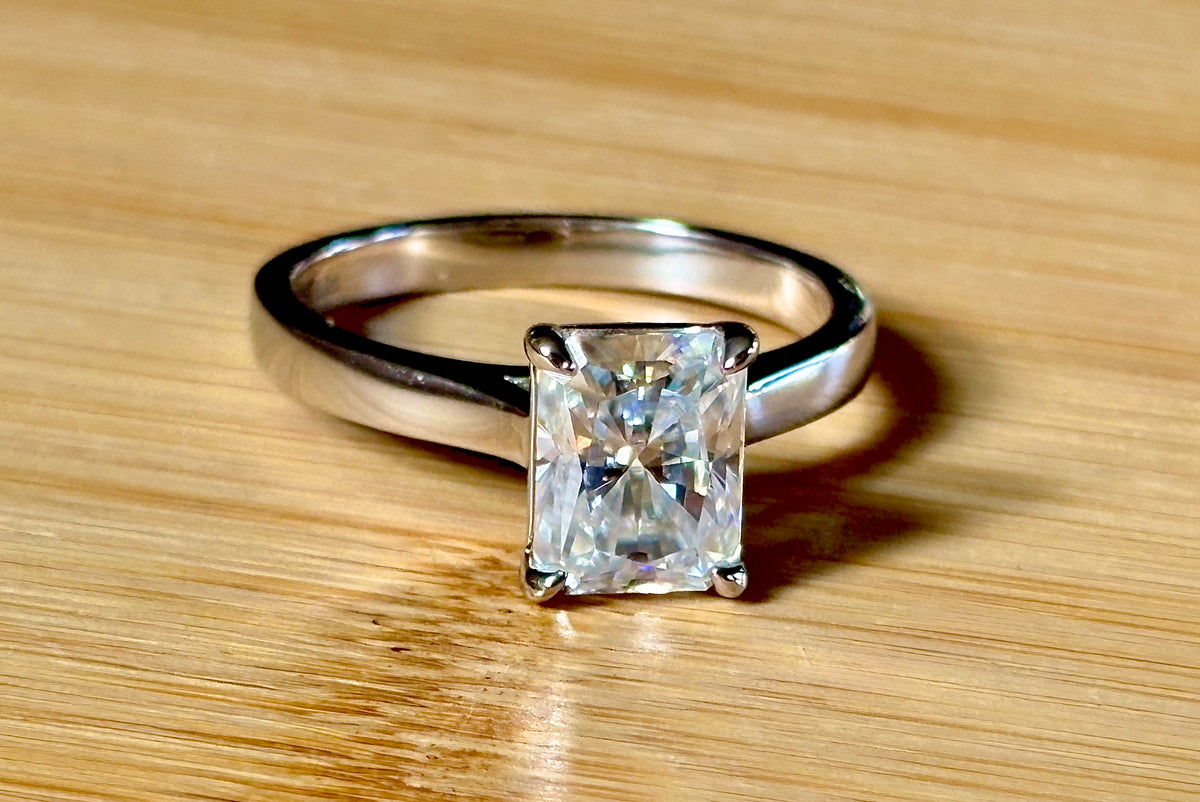 A certified Moissanite 3ct radiant solitaire! An UBER flashy, ULTRA classy, contemporary and chic radiant-cut engagement ring!