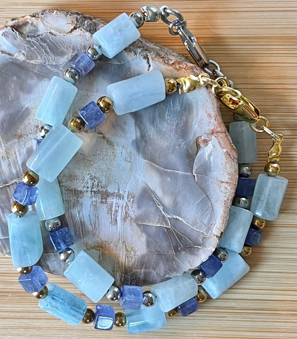 Aquamarine and tanzanite bracelet. The “True Blue” bracelet features trendy aquamarine barrels and dusky tanzanite cubes!