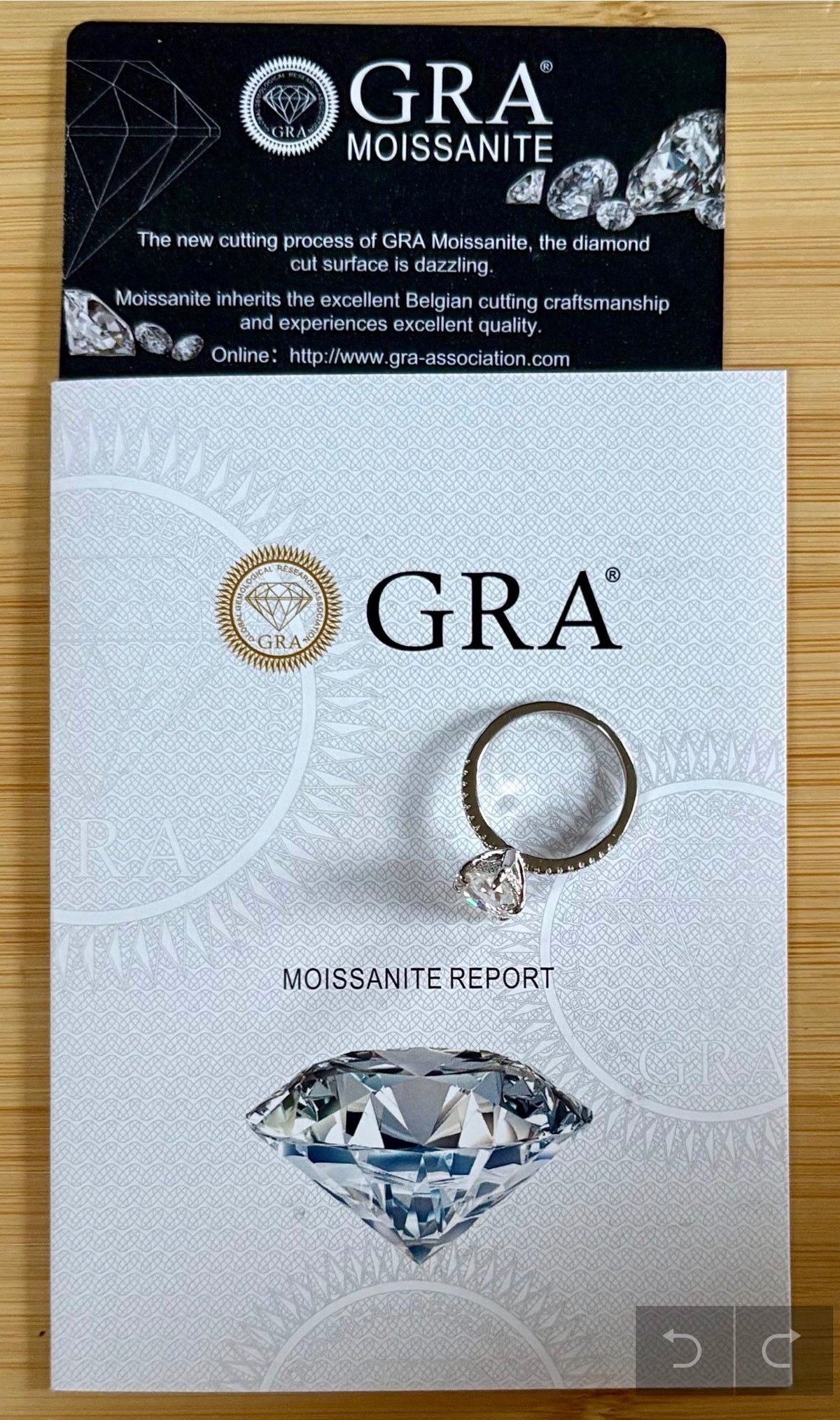 A certified 5ct pear-cut Moissanite solitaire in 925 sterling OR 935 Argentium silver with 18k, with pavé-set Moissanite shoulders and Moissanite hidden halo!