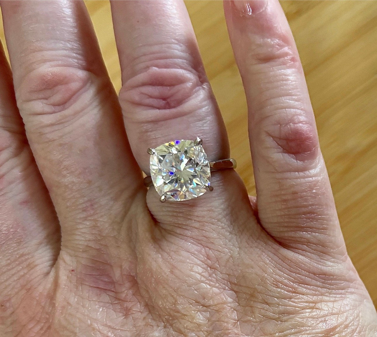 A fiery 9ct certified CLASSIC cushion-cut Moissanite solitaire, the ring of a certain princess (ex-princess?), but without the royal price tag! So indulge!