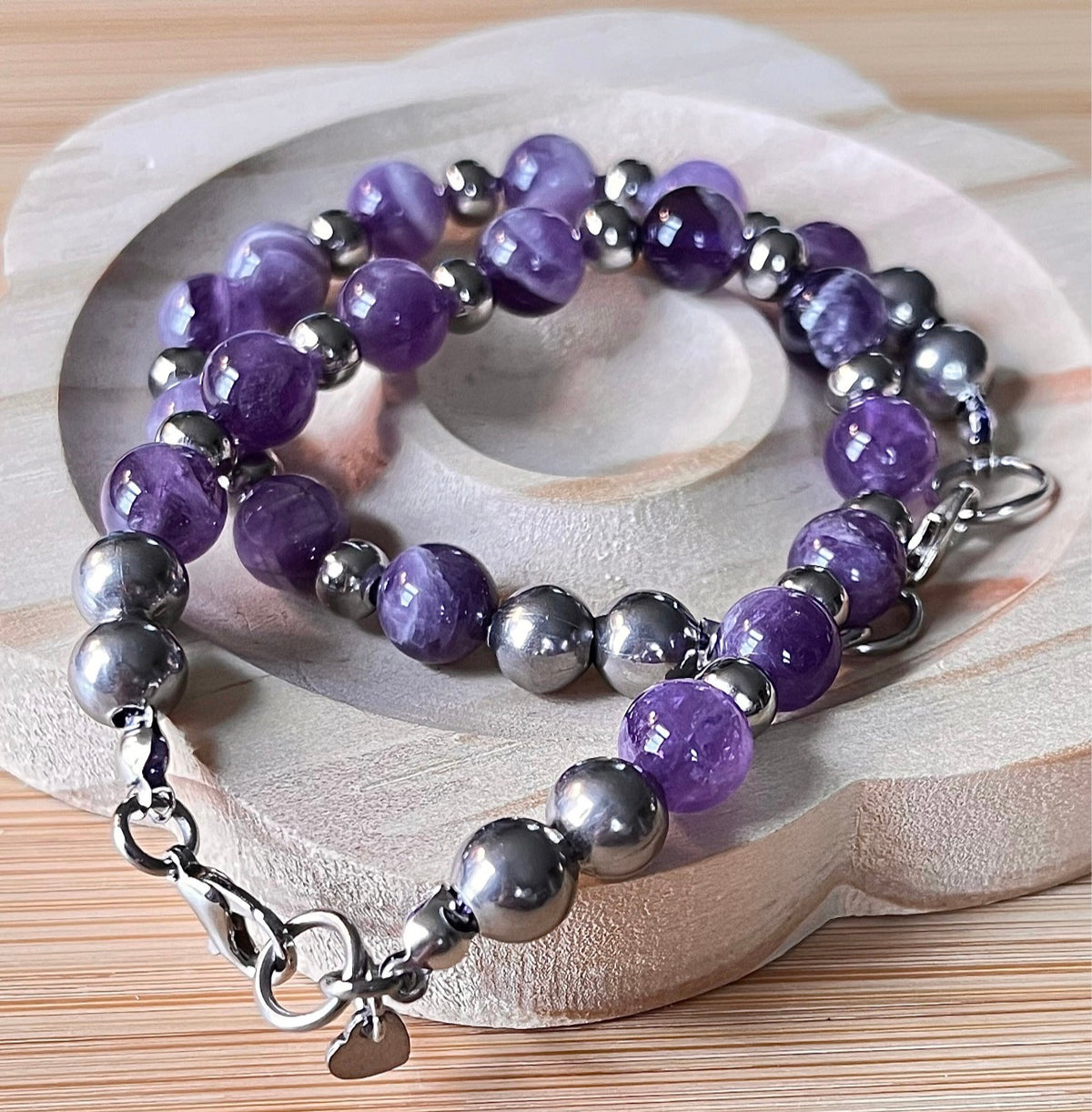 Amethyst bracelet. Pretty purple amethysts with chevron pattern crystallization! 8mm beads with durable stainless steel bracelet hardware!
