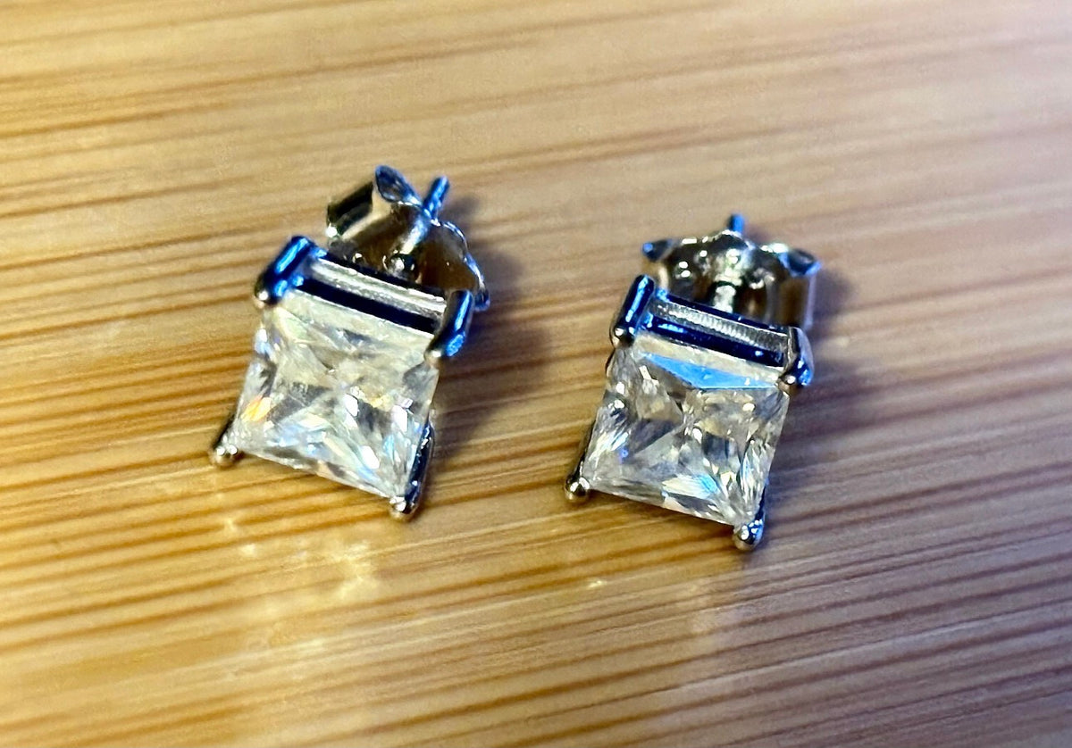 Moissanite studs. A perfect certified pair of 2cttw princess-cut Moissanites in solid sterling silver and 18k white rhodium!