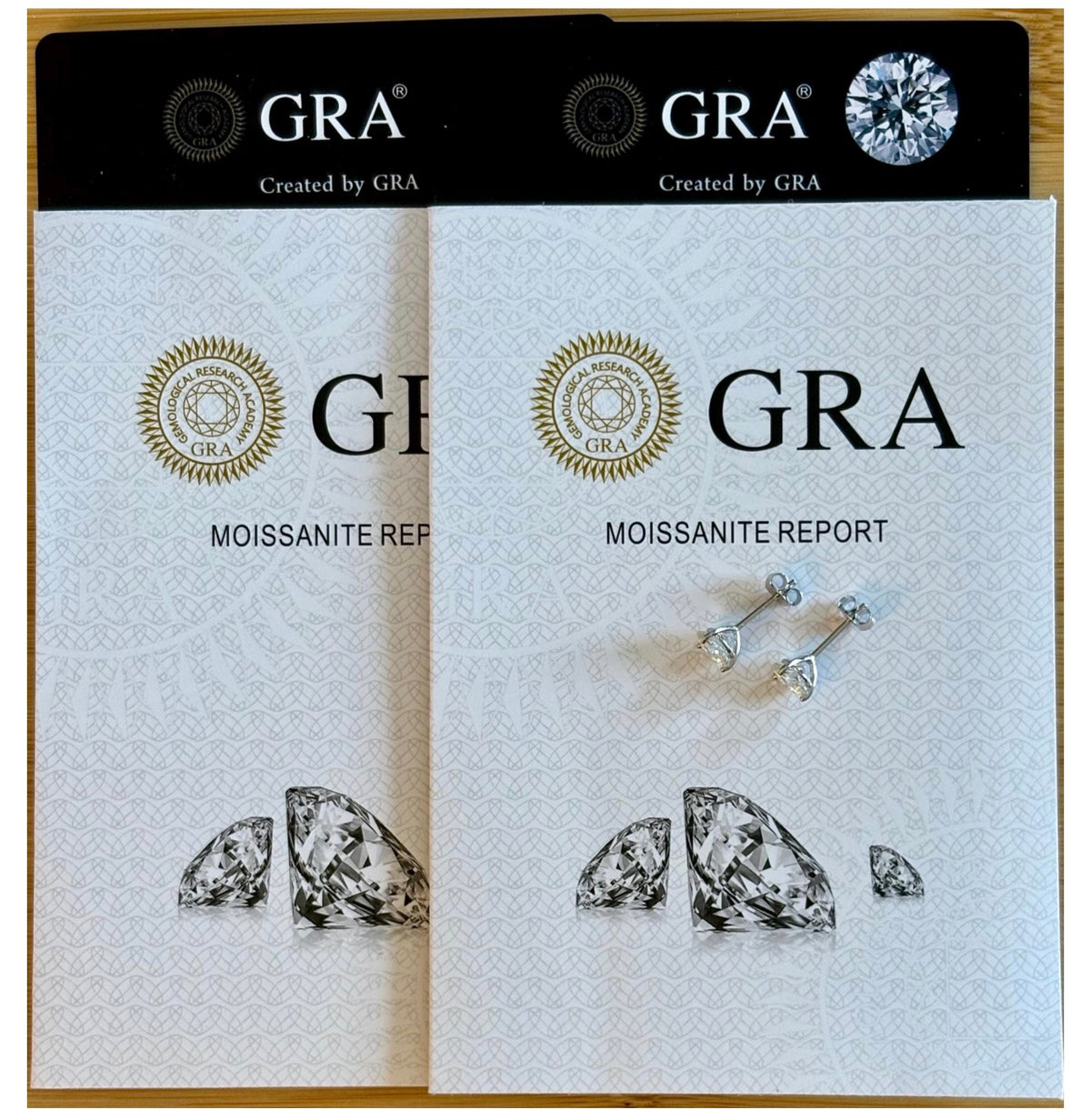 Moissanite studs. A 100-facet 2cttw pair of super bright, DOUBLE certified Moissanite studs in sterling silver and 18k white rhodium! Sublime!