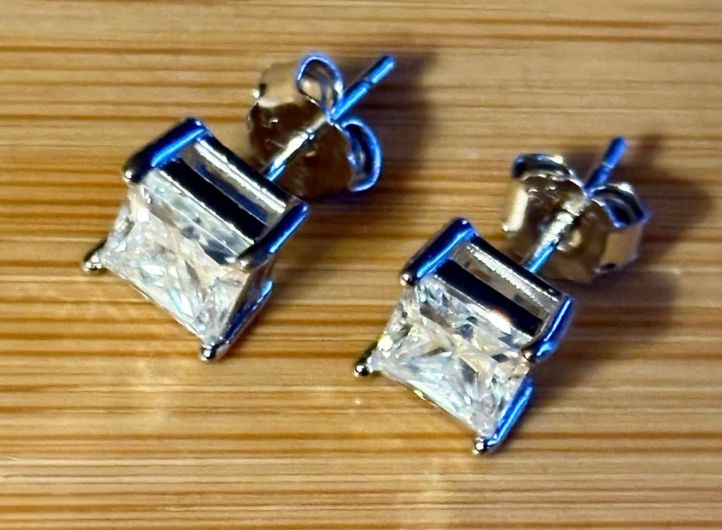 Moissanite studs. A perfect certified pair of 2cttw princess-cut Moissanites in solid sterling silver and 18k white rhodium!