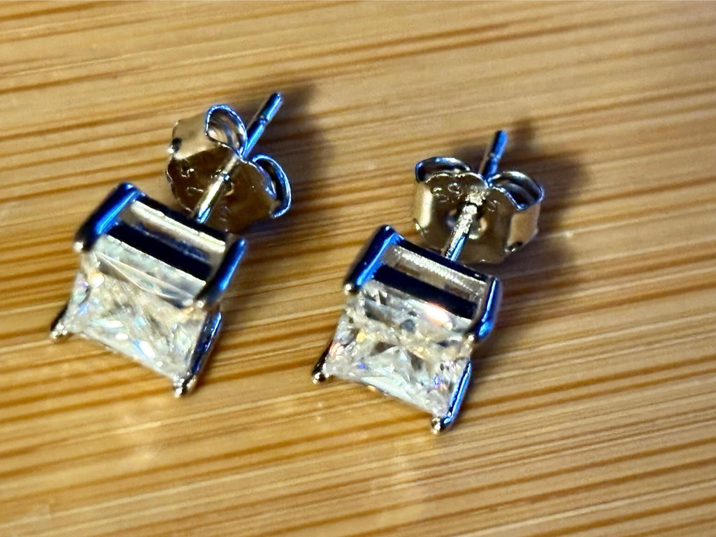 Moissanite studs. A perfect certified pair of 2cttw princess-cut Moissanites in solid sterling silver and 18k white rhodium!