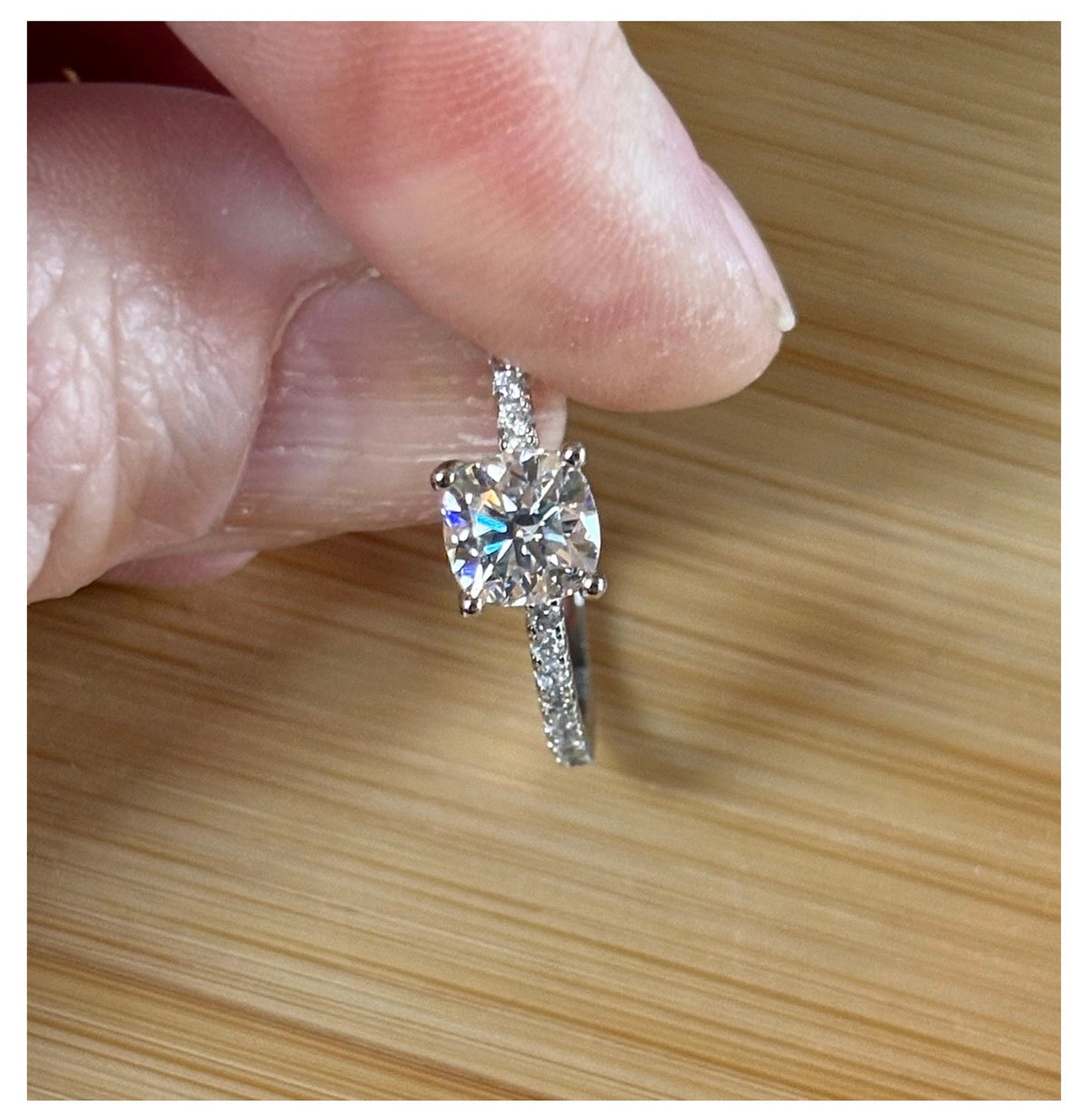 Moissanite solitaire. A certified 1ct cushion-cut Moissanite with pavé-set zircons in 925 sterling OR pavé-set Moissanites in 935 Argentium!
