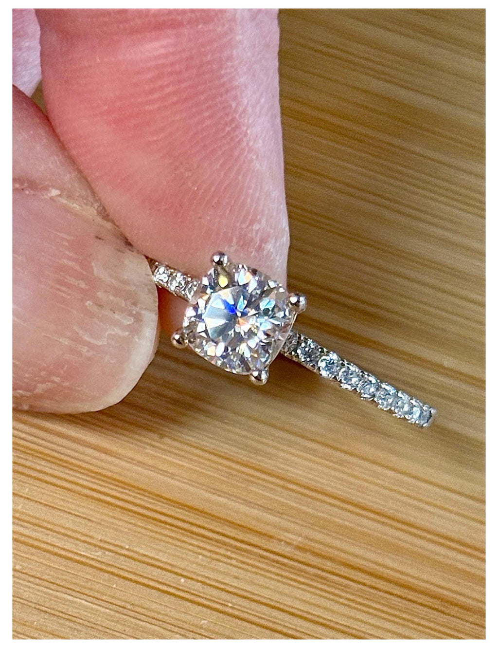 Moissanite solitaire. A certified 1ct cushion-cut Moissanite with pavé-set zircons in 925 sterling OR pavé-set Moissanites in 935 Argentium!