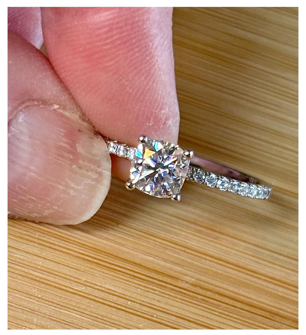 Moissanite solitaire. A certified 1ct cushion-cut Moissanite with pavé-set zircons in 925 sterling OR pavé-set Moissanites in 935 Argentium!