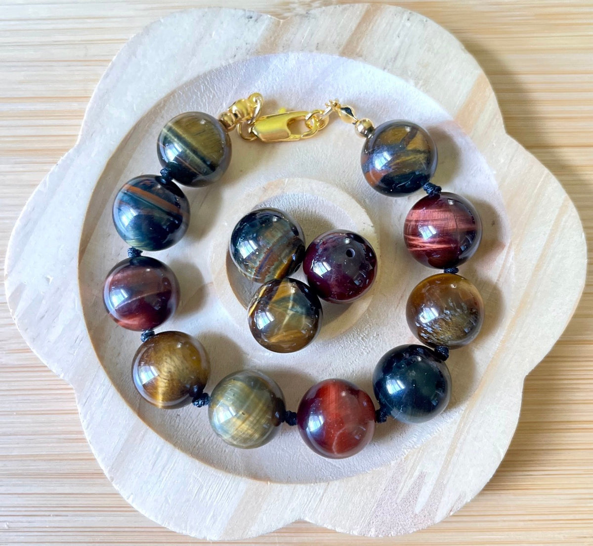 Tiger’s eye bracelet. 100% natural, highly chatoyant 14mm tricolored tiger’s eye hand knotted bracelet! Also available without the knots!