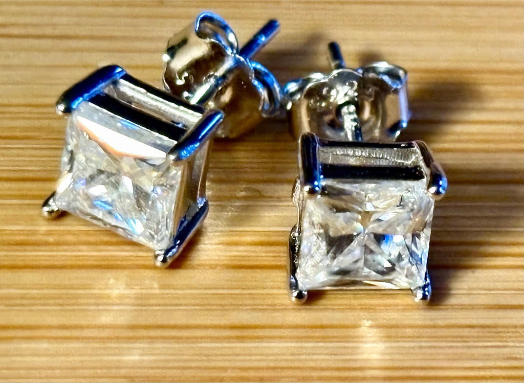 Moissanite studs. A perfect certified pair of 2cttw princess-cut Moissanites in solid sterling silver and 18k white rhodium!