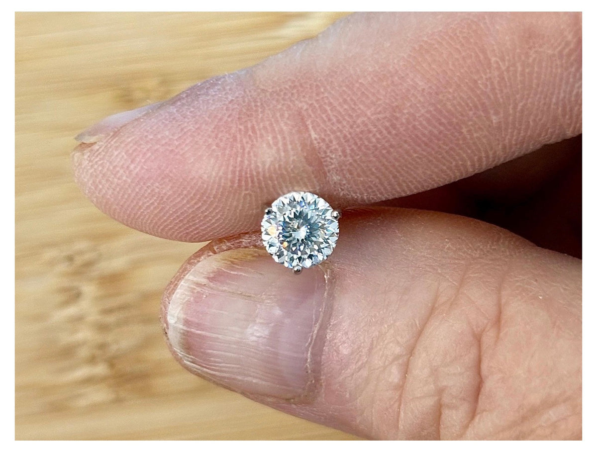 Moissanite studs. A 100-facet 2cttw pair of super bright, DOUBLE certified Moissanite studs in sterling silver and 18k white rhodium! Sublime!