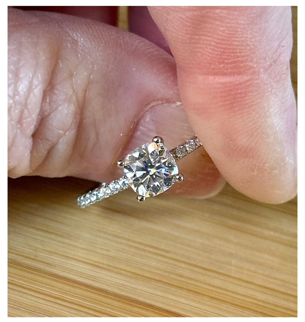 Moissanite solitaire. A certified 1ct cushion-cut Moissanite with pavé-set zircons in 925 sterling OR pavé-set Moissanites in 935 Argentium!