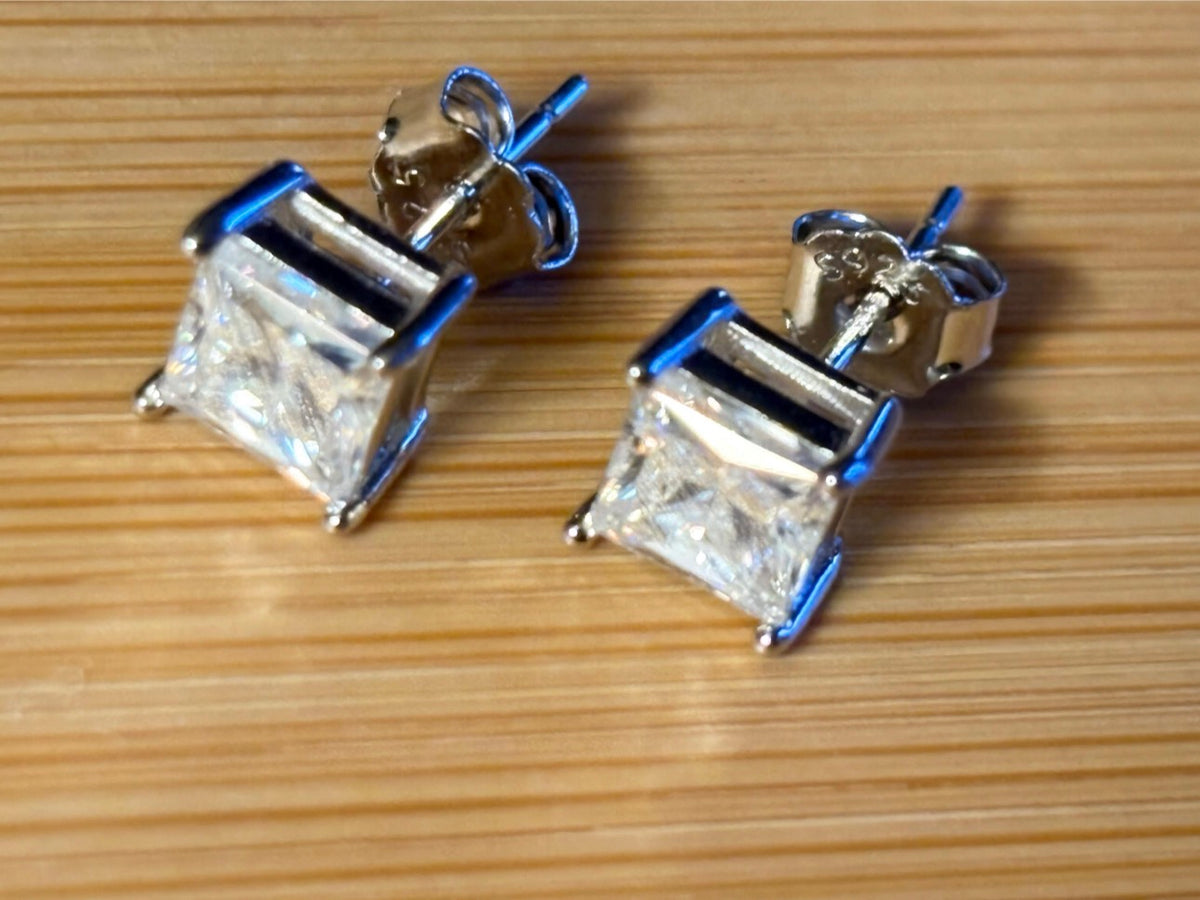 Moissanite studs. A perfect certified pair of 2cttw princess-cut Moissanites in solid sterling silver and 18k white rhodium!