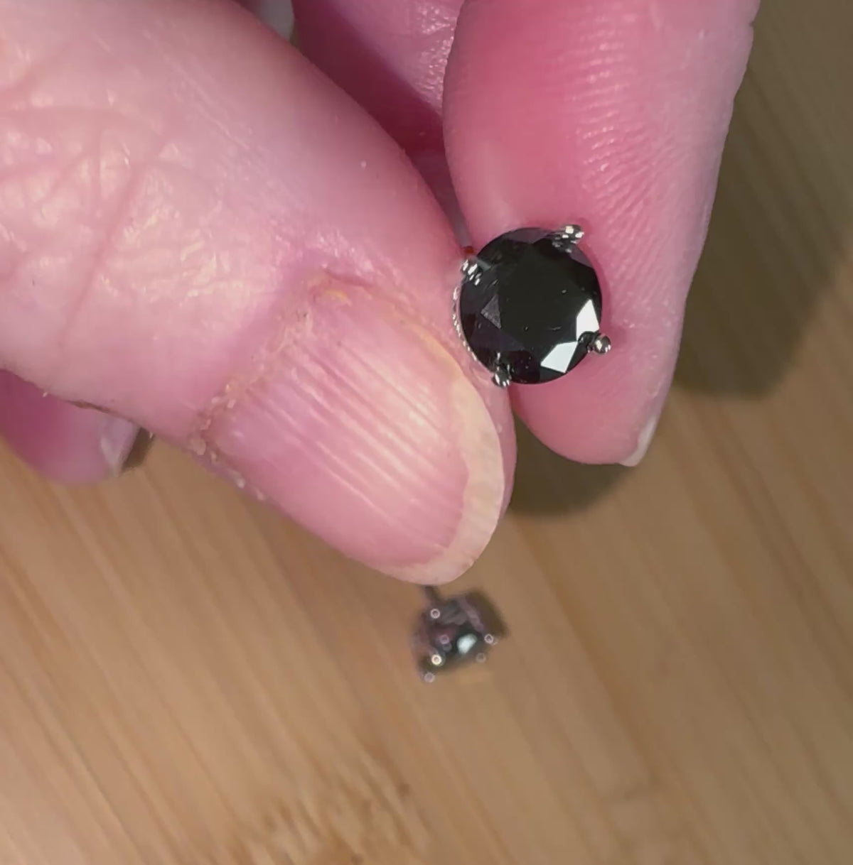 Moissanite studs. A 2cttw certified pair of black Moissanite studs in a sterling silver basket setting with 18k white gold plating!