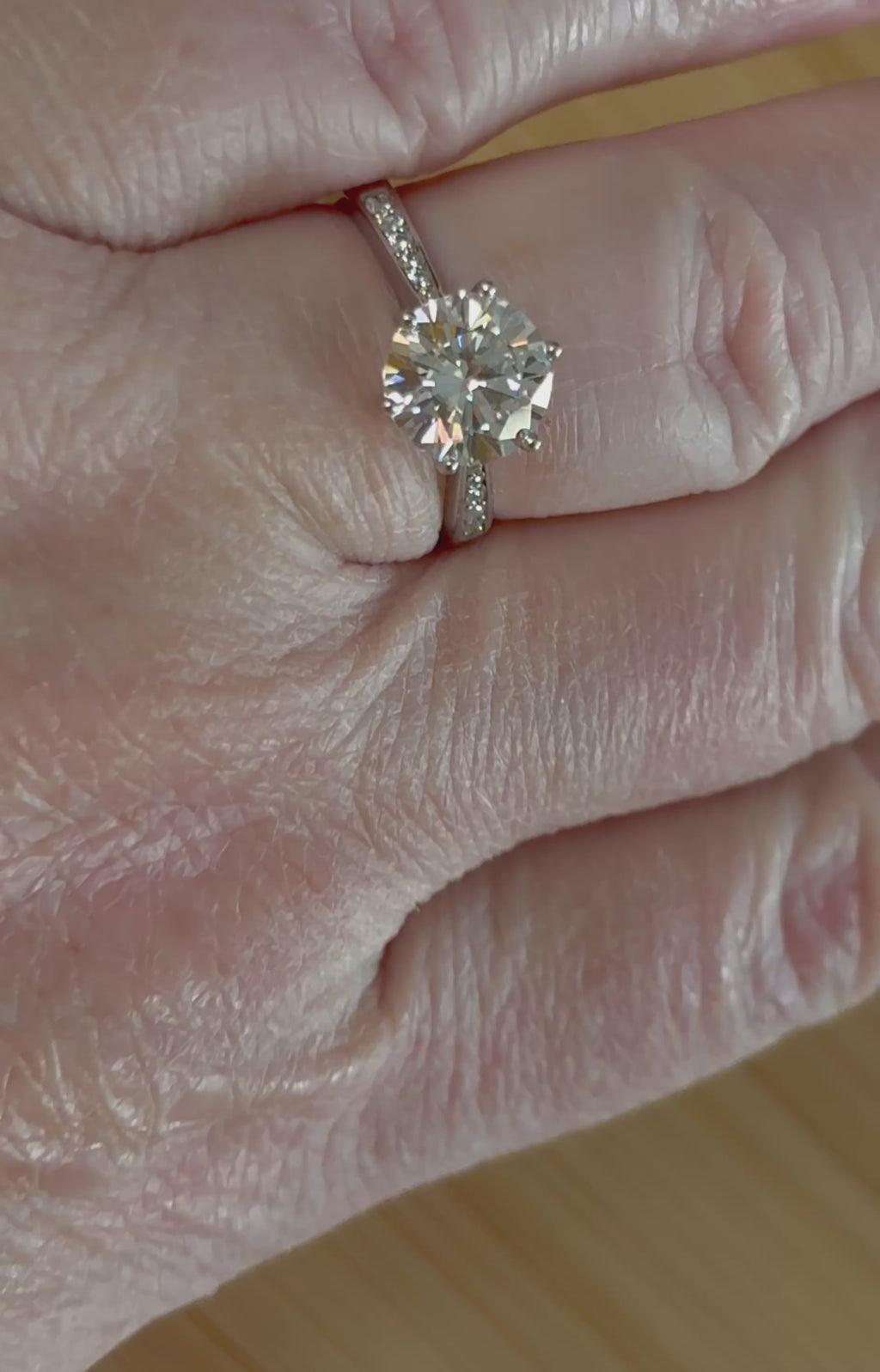 Moissanite ring. A delicious 3ct certified Moissanite solitaire with tapered shoulders and pavé-set white zircons in sterling and 18k gold!