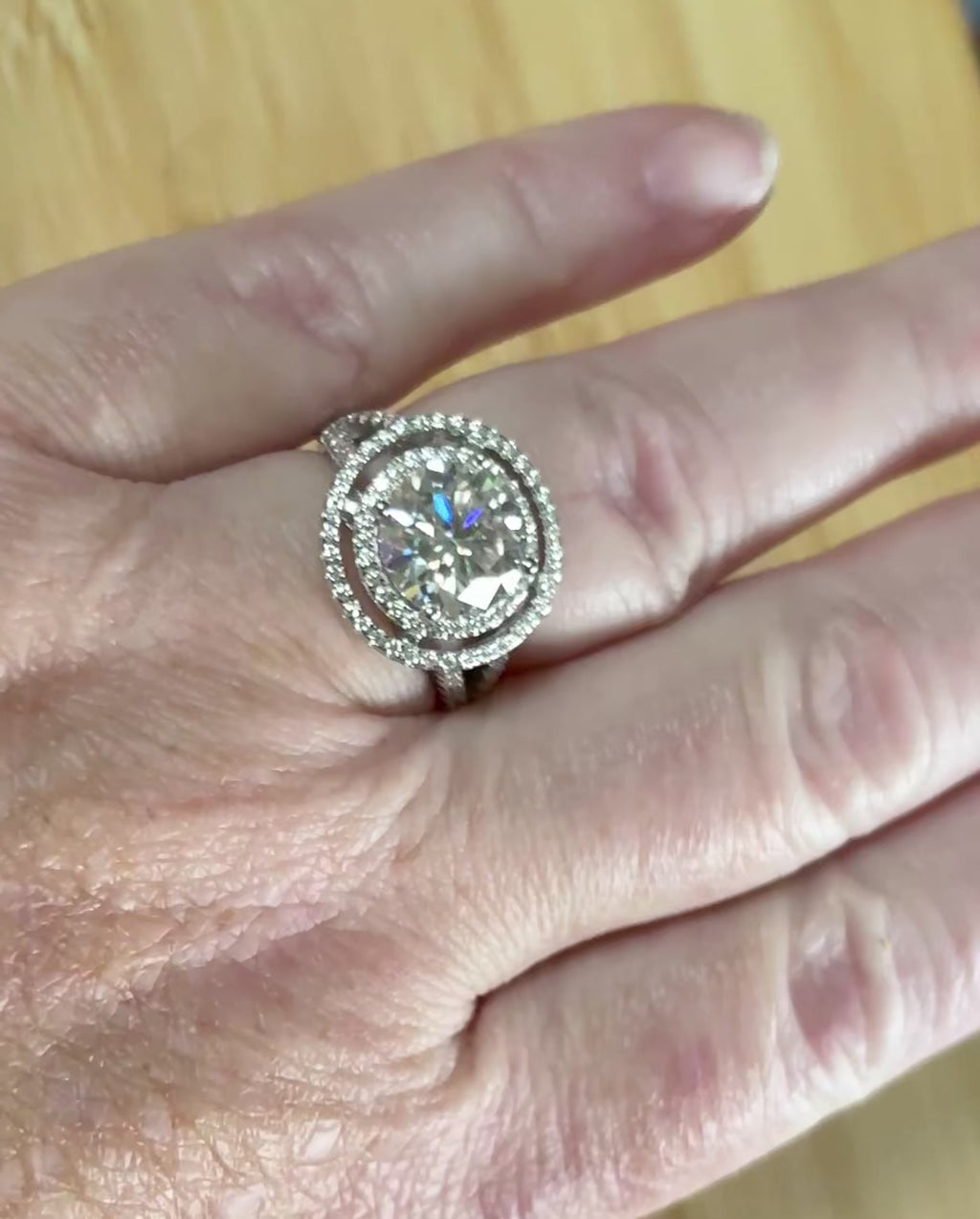Moissanite ring. The 6.64cttw *fully* Moissanite “Bull’s Eye” ring, featuring a 4ct certified round brilliant Moissanite in a double halo!