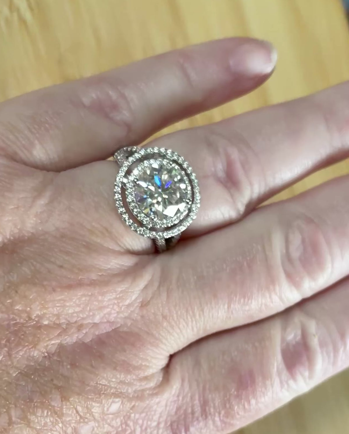 Moissanite ring. The 6.64cttw *fully* Moissanite “Bull’s Eye” ring, featuring a 4ct certified round brilliant Moissanite in a double halo!