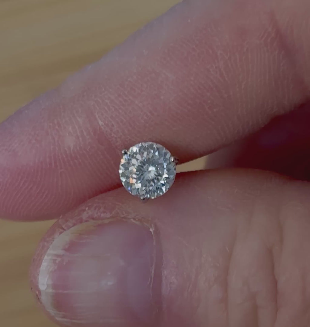 Moissanite studs. A 100-facet 2cttw pair of super bright, DOUBLE certified Moissanite studs in sterling silver and 18k white rhodium! Sublime!